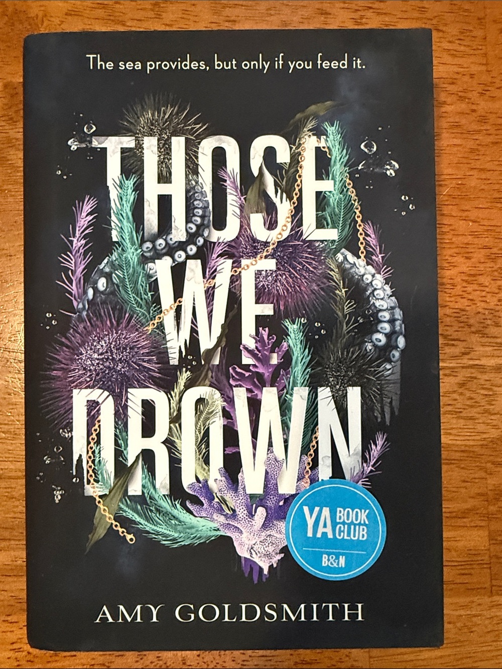Those We Drown by Amy Goldsmith - Black Cover with Purple & Teal Sea Motif